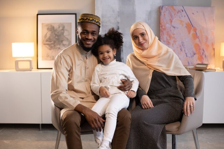 Happy black family in light room