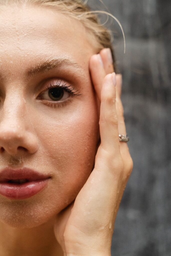 a close up of a person with a ring on her finger