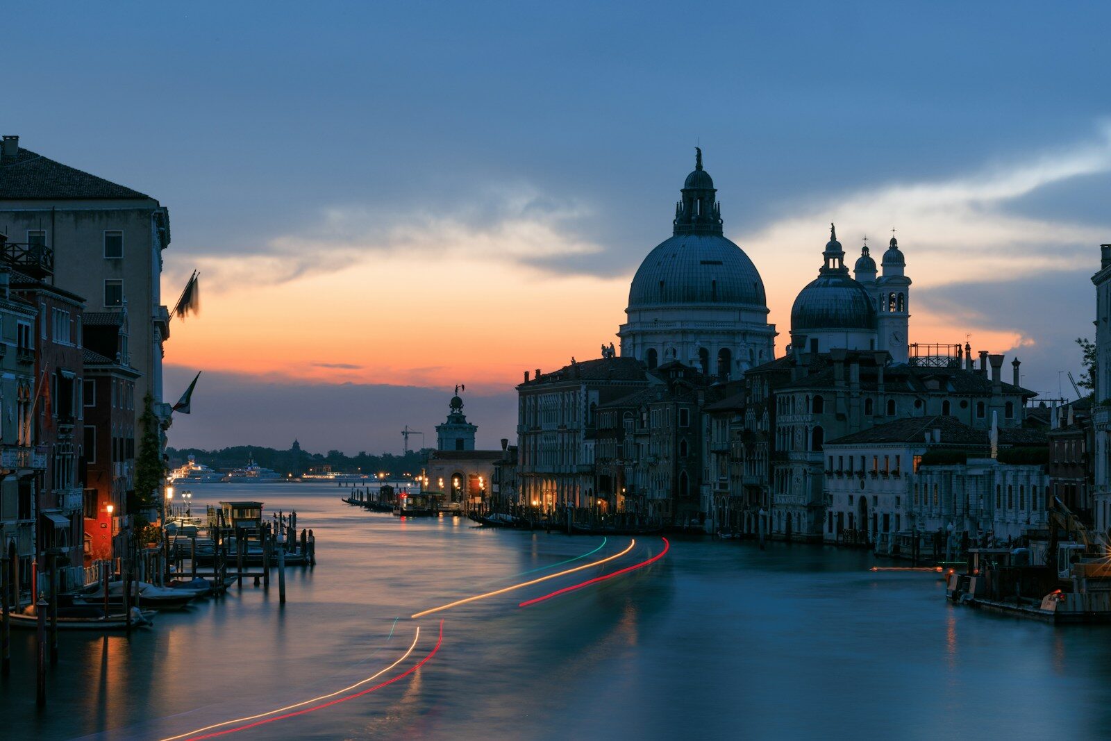 Venice grand canal at twilight with boat light trails.