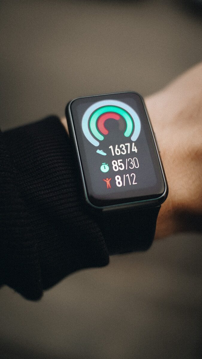 a close up of a person wearing a smart watch
