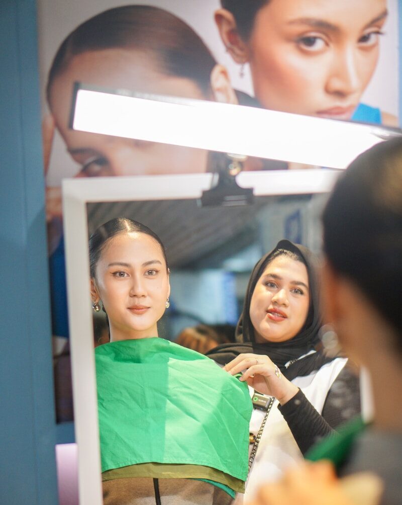 A woman getting her hair cut at a hair salon