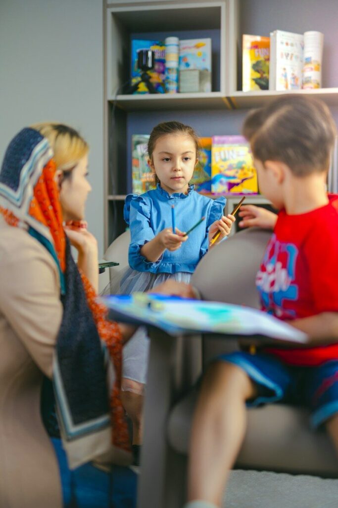 Children learning with a teacher in a classroom