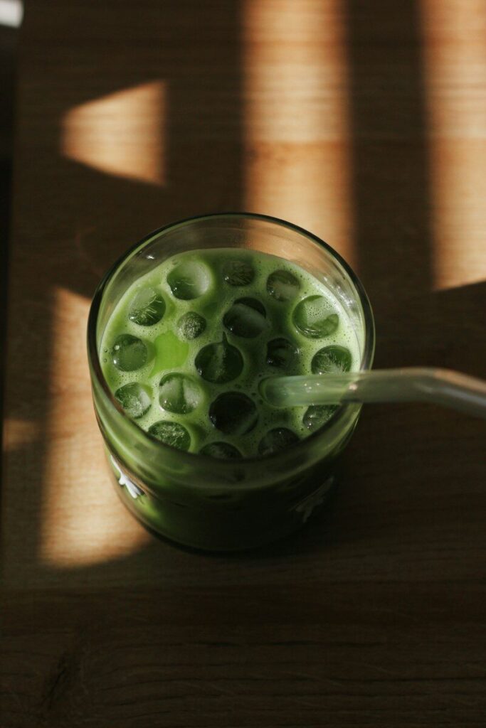 A refreshing iced matcha latte with ice cubes